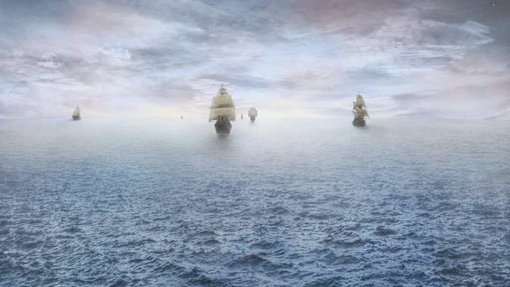 Des bateaux en mer avancent dans la brume