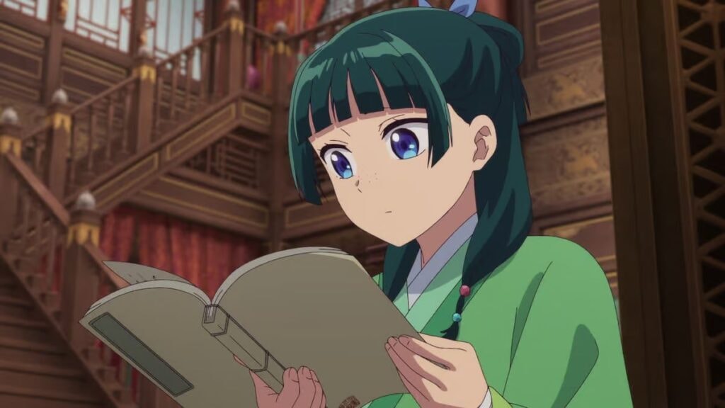 Mao Mao lisant un livre dans la cour impériale dans l'anime Les Carnets de l'Apothicaire