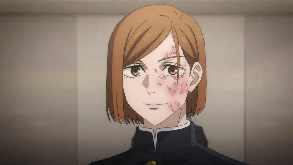 Nobara souriant malgré sa blessure lors du Drame de Shibuya dans Jujutsu Kaisen